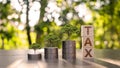 The tree grows on piles of money and lumps of wood with tax signs Royalty Free Stock Photo