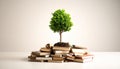Tree of Knowledge: Sapling Growing from Stack of Books, Symbolizing Education Royalty Free Stock Photo