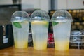 Tree plastic cups with lemonade in fast food cafe