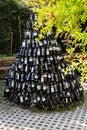 tree pyramid made from empty wine bottles