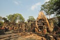 Tree root overgrowing parts of ancient Preah Khan Temple at angkor Wat Area ,Cambodia Royalty Free Stock Photo