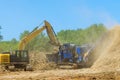 Tree roots are loaded into an industrial shredder machine a chopped into wood Royalty Free Stock Photo