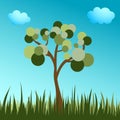 tree with a round crown on a blue background with green grass Royalty Free Stock Photo