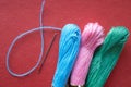 Tree skeins of yarn and one needle Royalty Free Stock Photo
