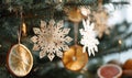 A tree with snowflake decorations and oranges hanging from it Royalty Free Stock Photo