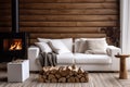 Tree stump coffee table near white sofa and pouf against wood paneling wall with fireplace and stack of firewood