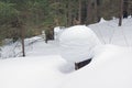 Tree stump in deep snow in a forest in winter Royalty Free Stock Photo