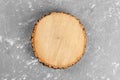 Tree stump round cut with annual rings on cement background. top view with copy space Royalty Free Stock Photo