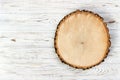 Tree stump round cut with annual rings on wooden background. top view with copy space Royalty Free Stock Photo