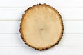 Tree stump round cut with annual rings on wooden background. top view with copy space Royalty Free Stock Photo