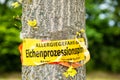 Tree with text vorsicht allergiegefahr durch eichenprozessionsspinner Raupen und Nester nicht berÃÂ¼hren, in englisch beware of