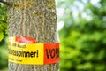 Tree with text vorsicht allergiegefahr durch eichenprozessionsspinner Raupen und Nester nicht berÃÂ¼hren, in englisch beware of