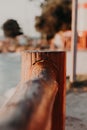 tree trunk that forms part of a port on the beach Royalty Free Stock Photo