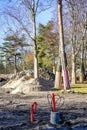 Tree trunks on a construction site covered with boards to protect them from damage