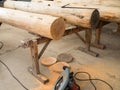 Tree trunks on wooden trestles Royalty Free Stock Photo