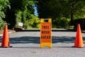 Tree Work Ahead Sign with Two Traffic Cones Royalty Free Stock Photo