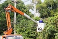 Tree Worker evaluating the job from a bucket truck