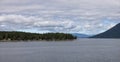 Treed Island with Homes and docks, surrounded by other islands Royalty Free Stock Photo