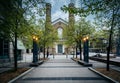 Trees along a walkway and the Church of the Holy Trinity at Trinity Square, in downtown Toronto, Ontario. Royalty Free Stock Photo