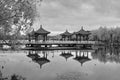 Chinese Architecture pavilion reflected in calm lake reflection mirror black and white Royalty Free Stock Photo