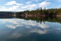 Trees and clouds reflected in Lake Britton in McArthur Burney Falls Memorial State Park, California, USA Royalty Free Stock Photo