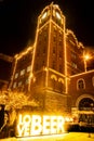 St Louis, Missouri, USA, Dec 2019 - Glowing LOVE BEER sign, christmas lights anheuser busch brewery clock tower winter