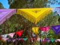 Trees dressed with colorful Manila shawls. Royalty Free Stock Photo