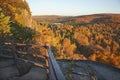 Trees in fall color, hills and lake viewed from a scenic overloo