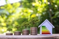 Trees grow on piles of money and energy saving charts in a home office model.