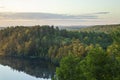 Trees on hills at dawn by a lake near the Gunflint Trail in northern Minnesota during summer