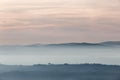 Trees, hills and fog