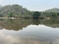 Trees and hills reflecting in a lake