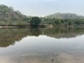 Trees and hills reflecting in a lake