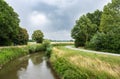 Trees reflecting in the bending River Demer, Flanders, Belgium