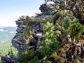 Trees and rock cliffs at the mountain top Royalty Free Stock Photo
