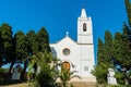 Trees on the sides of Iglesia Santa Maria Magdalena under the blue sky