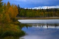 Early autumn sky and trees water reflection. Royalty Free Stock Photo