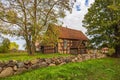 Trees, stone wall and building in Carwitz, Germany Royalty Free Stock Photo