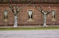 Trees and three windows in historic house Royalty Free Stock Photo