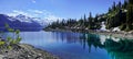 The trees were reflected in the clear water of the lake