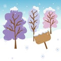 Trees and wooden sign covered by snow in the winter seasonal with the snow flake falling down. Royalty Free Stock Photo