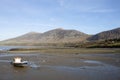 Lone small fishing boat at a deserted beach at Trefor, near Caernarfon, North Wales