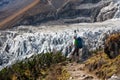 Trekker in front of Manaslu glacier on Manaslu circuit trek in N