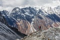 Trekker goes down fron Larke La pass on Manaslu circuit trek in Royalty Free Stock Photo