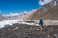 A trekker looking to Paiju mountain peak in K2 base camp trekking route, Karakoram mountain range in Gilgit Baltistan, Pakistan Royalty Free Stock Photo