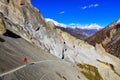 Trekker in red jacket in Himalayas mountains Royalty Free Stock Photo