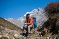Trekker rests on Manaslu circuit trek in Nepal Royalty Free Stock Photo