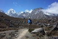 Trekker is standing on the trail to Ama Dablam base camp, Nepal