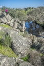 Trekker woman at Berrocal of Rugidero, Cornalvo Natural Park, Extremadura, Spain