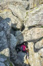 Trekker woman visiting spectacular granitic rock eroded by floods. Cornalvo Natural Park, Extremadura, Spain Royalty Free Stock Photo